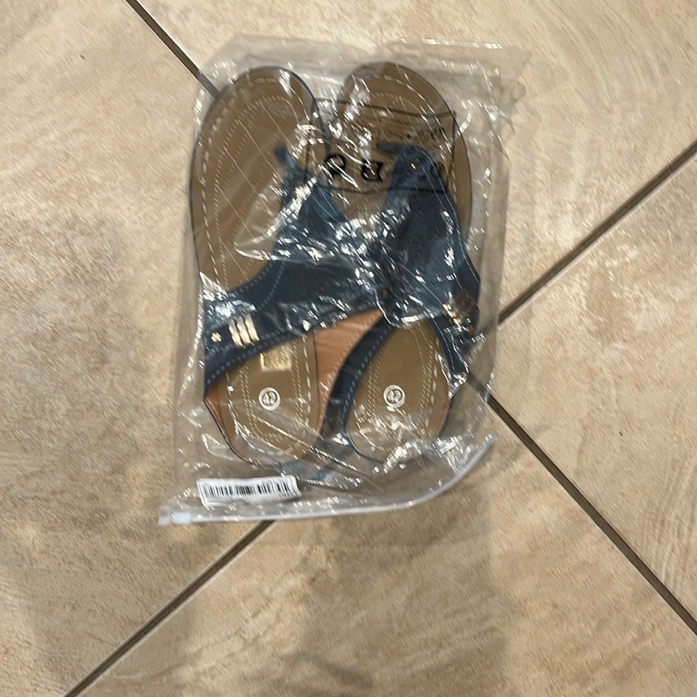 Manmade upper, dark blue, said size 10, but small 9.5-9. Plastic bottom.